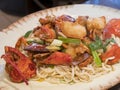 Close up shot of a Chinese style fried lobster and noodles