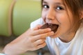 Close up shot of choco pie is eaten by chubby teenage girl. Looks delicious.