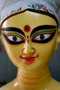 Close up shot of clay idol of Goddess Devi Durga, before upcoming Durga Puja at a potter`s studio in Kolkata