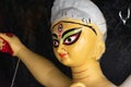 Close up shot of clay idol of Goddess Devi Durga, before upcoming Durga Puja at a potter`s studio in Kolkata