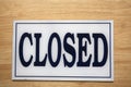 Close up shot of close sign on wooden background Royalty Free Stock Photo