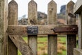 Close up shot of a closed gate that stops sheep passing through that says Stock Grazing on the front Royalty Free Stock Photo