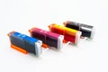 Close-up shot of a CMYK ink cartridges for a color printer isolated on a white background with clipping path. Royalty Free Stock Photo