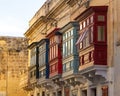 Close-up shot of colorful closed balconies on a building