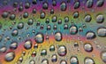 Colorful of close up rainbow droplets. Royalty Free Stock Photo