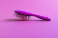 Close up shot of a colorful hairbrush. Concept Royalty Free Stock Photo