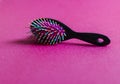 Close up shot of a colorful hairbrush. Concept Royalty Free Stock Photo