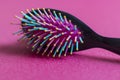 Close up shot of a colorful hairbrush. Concept Royalty Free Stock Photo