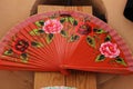 Close up shot of a colorful handheld folding fan