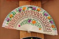 Close up shot of a colorful handheld folding fan