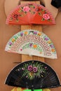 Close up shot of a colorful handheld folding fans Royalty Free Stock Photo