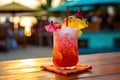 A close-up shot of a colorful tropical cocktail on a beachside bar