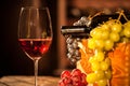 Close-up shot of composition of wine glass, bottle and fruit box.