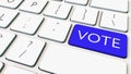 Close-up shot of computer keyboard and blue vote key. Conceptual 3D rendering Royalty Free Stock Photo