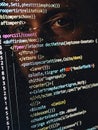Close up of computer screen displaying lines of code with a persons reflection Royalty Free Stock Photo