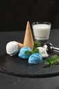 Close-up shot of a creamy and blueberry ice cream served on a dark slate, black background. Royalty Free Stock Photo