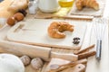 Close up shot of Croissant and bekery ingredients on wooden table