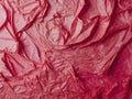 Close-up shot of a crumpled pink plastic bag