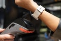 Close-up shot of a customer making a payment using a smartwatch Royalty Free Stock Photo