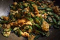 Close up shot of cut okra, Organic Homemade stir fly green okra with eggs and pickled garlic.