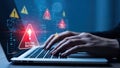 Cybersecurity expert typing on laptop with system warning pop-ups, illustrating data breach and digital security threats Royalty Free Stock Photo