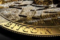 Close-up shot on damaged Bitcoin laying on dark background. Bitcoin crash concept. 3D rendering