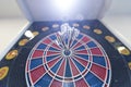 Close up shot of the dart arrow hit on bulleyes of dartboard to represent that the business reached the target of Royalty Free Stock Photo