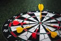 Close up shot of a dart board. Darts arrow Missing the target on a dart board during the game.