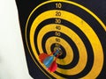 Close up shot of a dart board. Darts arrow Missing the target on a dart board during the game. Darts yellow Royalty Free Stock Photo