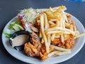 Close up shot of deep fried French fries and fried chicken Royalty Free Stock Photo