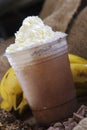 Close up shot of delicious creamy chocolate cold milkshake with whipped cream on top