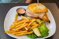 Close up shot of delicious grilled chicken breast sandwich and french fries Royalty Free Stock Photo