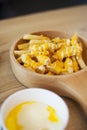 Delicious cheese fries is served on a bowl