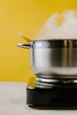 close-up shot of delicious spaghetti boiling in stewpot on yellow