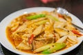 Close up shot of a dish of fried tofu, swim bladder with mushroom