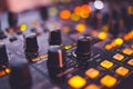 Close-up shot of a dj mixer's knobs and sliders in soft studio lighting Royalty Free Stock Photo