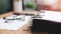 Close up shot of documents and eyeglasses on table Royalty Free Stock Photo