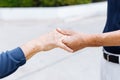 Close up shot of elderly senior couple holding hands and supporting with each other. Royalty Free Stock Photo