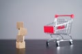 Close up shot of empty wooden blocks with shopping cart