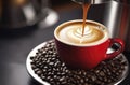 Close-up shot of espresso pouring from a coffee machine into a red cup of coffee. Professional coffee preparation Royalty Free Stock Photo