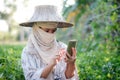 Close up shot farmer using mobile smartphone in the nature farm