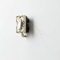 Close Up of a Damaged White Electrical Wall Light Switch with Crack on White Wall Background Indoor Home Wiring System and Safety Royalty Free Stock Photo