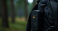Outdoor Electronic Device on Backpack Strap in Forest Royalty Free Stock Photo