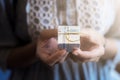 Close up shot of female hands holding a little gift