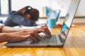 Close-up shot of female hands typing on laptop Royalty Free Stock Photo