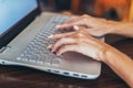 Close-up shot of female hands typing on laptop keyboard Royalty Free Stock Photo