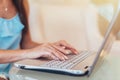 Close-up shot of female hands typing on laptop keyboard Royalty Free Stock Photo