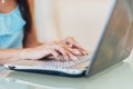 Close-up shot of female hands typing on laptop keyboard Royalty Free Stock Photo