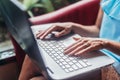 Close-up shot of female hands typing on laptop keyboard Royalty Free Stock Photo