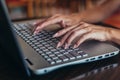 Close-up shot of female hands typing on laptop keyboard Royalty Free Stock Photo